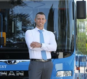 Image of a man standing in front of Arriva bus